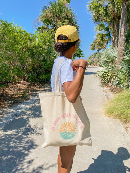 dream with the sea tote bag
