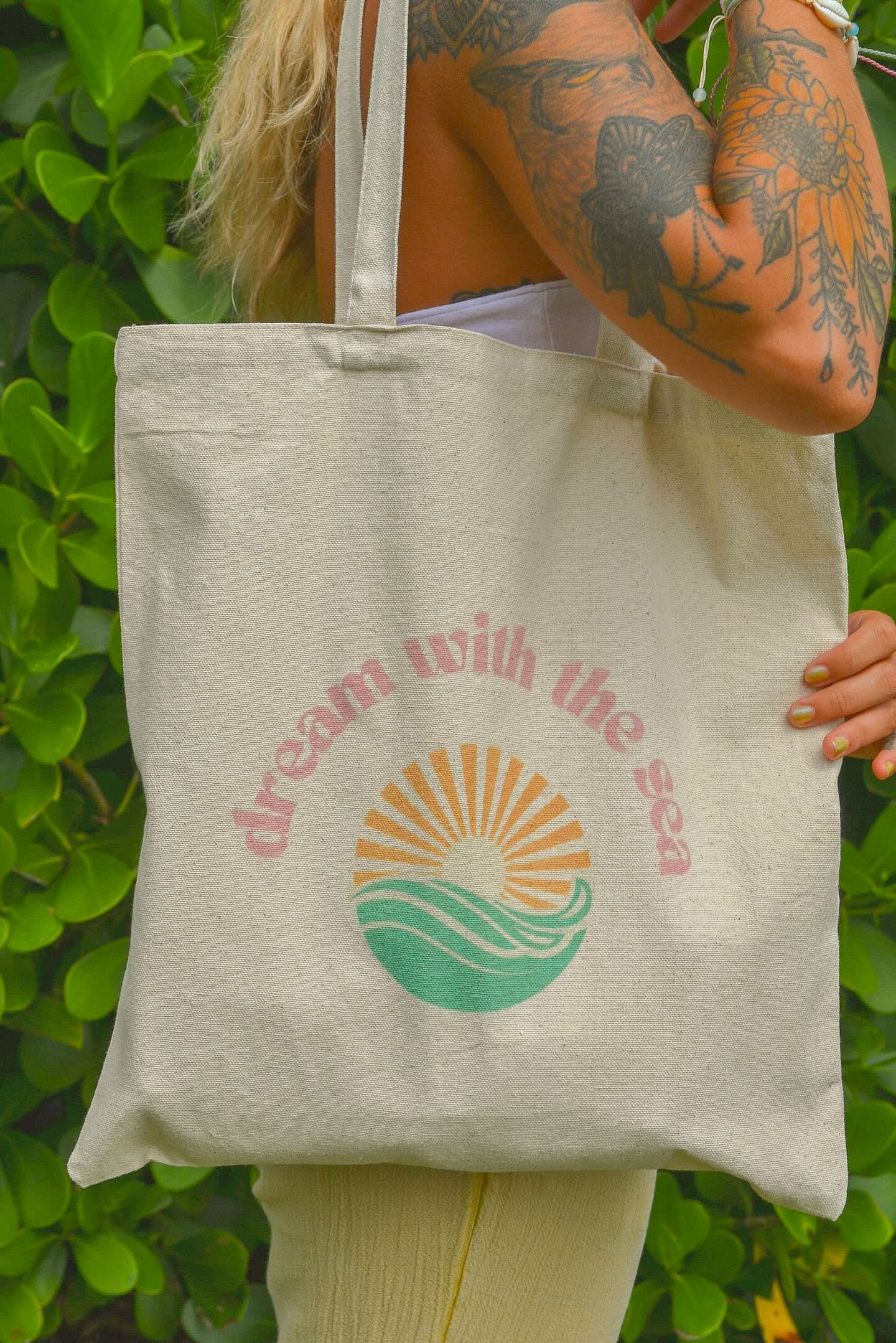 dream with the sea tote bag